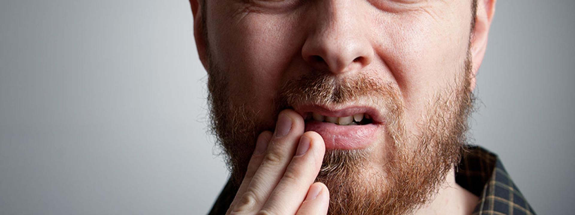 Man in tooth pain