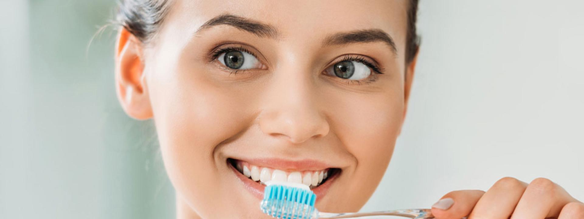 Woman brush her teeth